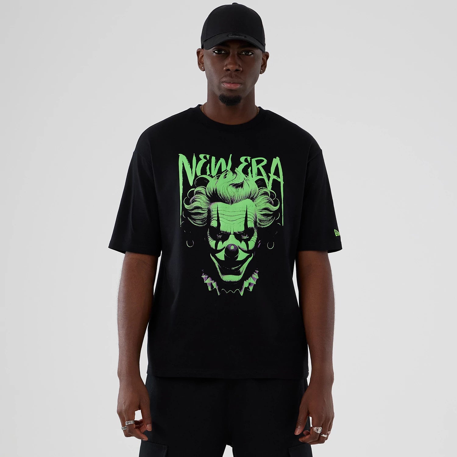 The Male model is wearing  New Era Halloween Clown Graphic Black Oversized T-Shirt 1