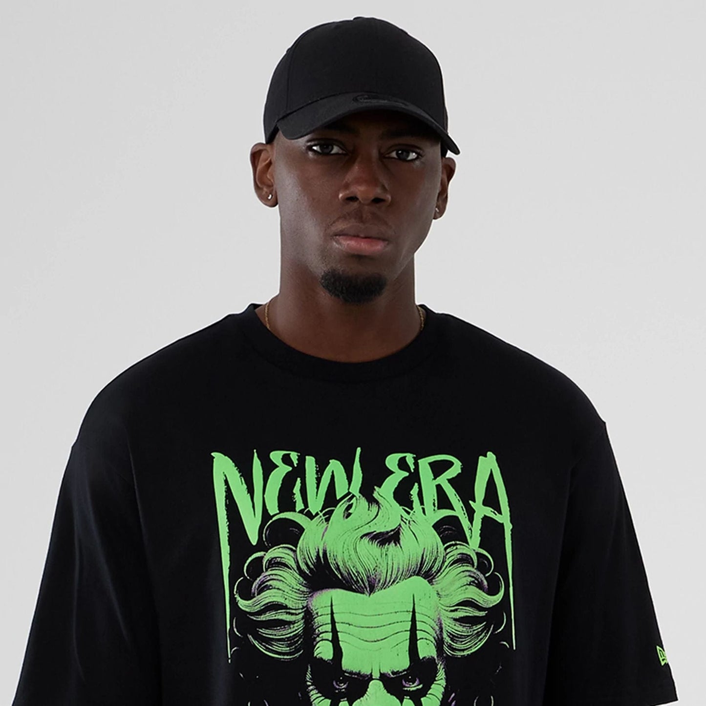 The Male model is wearing  New Era Halloween Clown Graphic Black Oversized T-Shirt  6