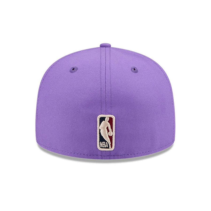 Pictured is this NBA Hardwood Classic Toronto Raptors 59FIFTY Fitted cap in bright purple. 5
