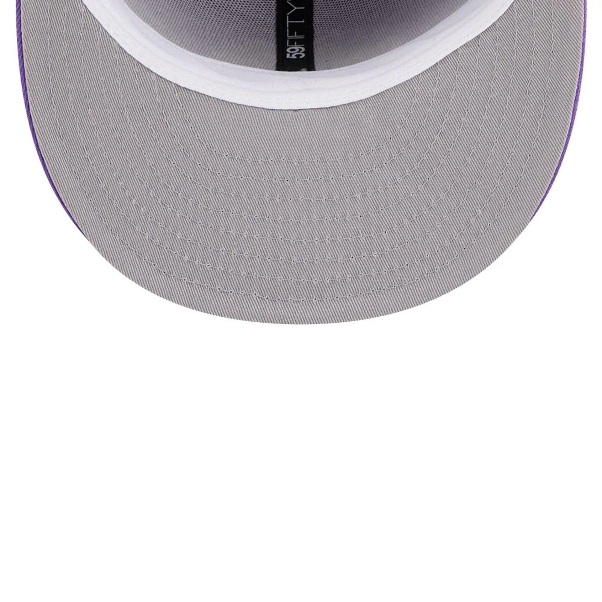 Pictured is this NBA Hardwood Classic Toronto Raptors 59FIFTY Fitted cap in bright purple. 2