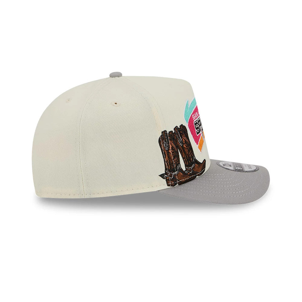 San Antonio Spurs NBA Grey New Era 9FIFTY A-Frame Snapback Adjustable Cap, side view with embroidered brown cowboy boots on the side panel and a flat grey visor with a 9FIFTY size sticker.