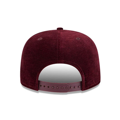 Pictured is this New Era Holiday Essentials 9FIFTY A-Frame Snapback cap in dark purple. 5