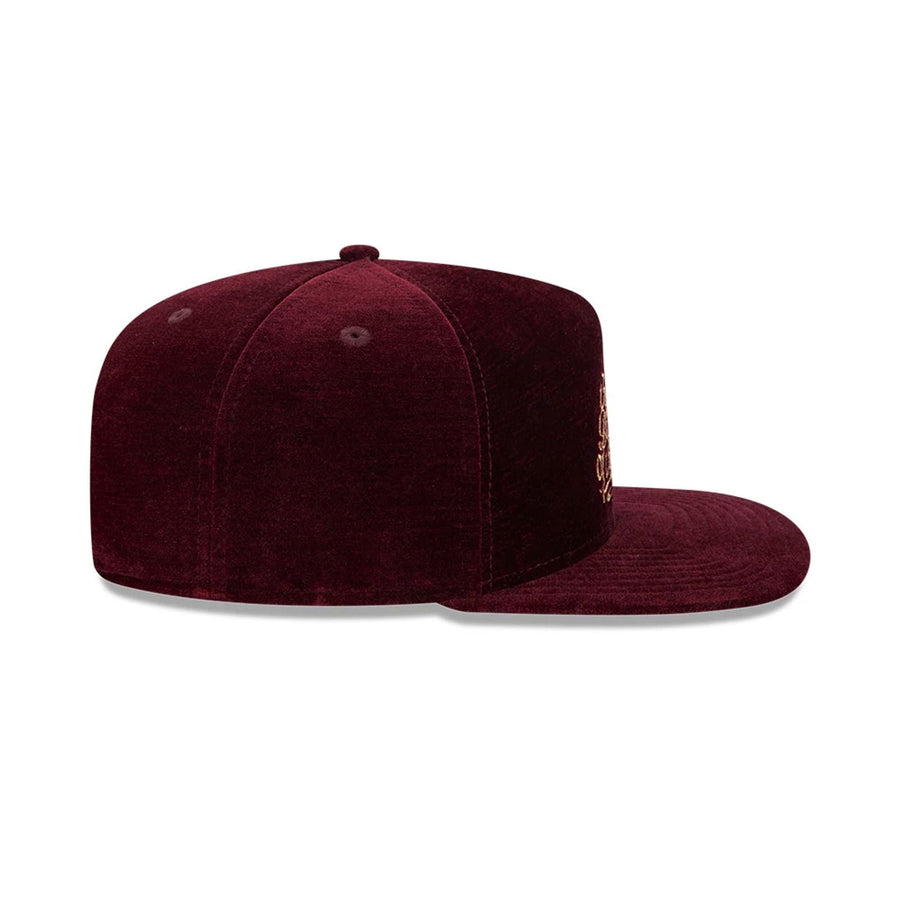 Pictured is this New Era Holiday Essentials 9FIFTY A-Frame Snapback cap in dark purple. 7