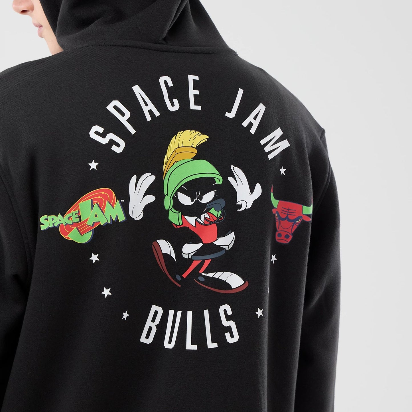 The model is wearing this Space Jam 2 X NBA Chicago Bulls Pullover Hoodie in black. 4