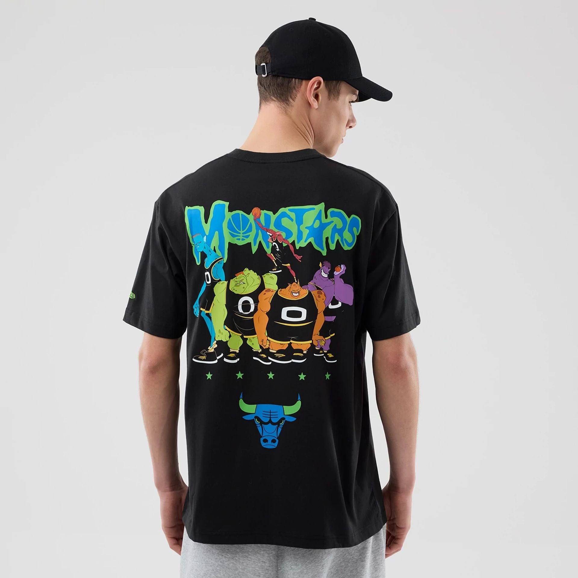 The model is wearing this Space Jam 2 X NBA Chicago Bulls T-Shirt in black. 2