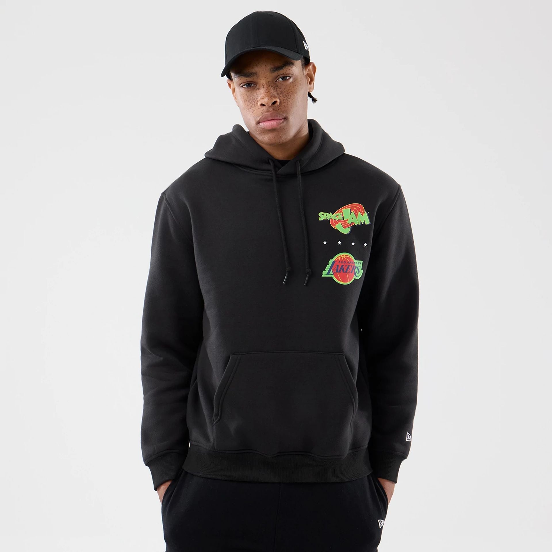 The model is wearing this Space Jam 2 X NBA LA Lakers Pullover Hoodie in black. 1