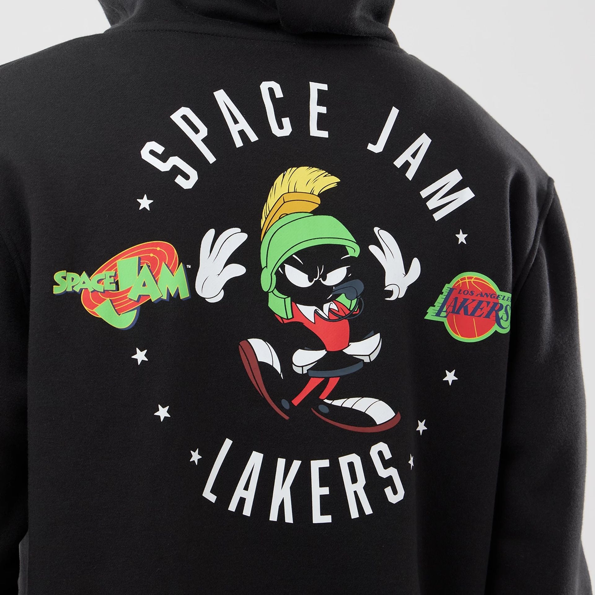 The model is wearing this Space Jam 2 X NBA LA Lakers Pullover Hoodie in black. 4