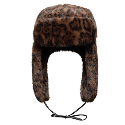 New Era Leopard Brown Trapper Hat, front view showing the luxurious faux fur exterior with a leopard print pattern, featuring long ear flaps and a black adjustable chin cord for a snug fit.