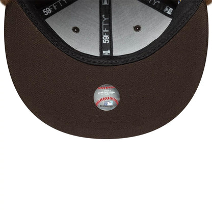 Pictured is this MLB World Series New York Yankees Dogear 59FIFTY Fitted cap in dark brown. 11