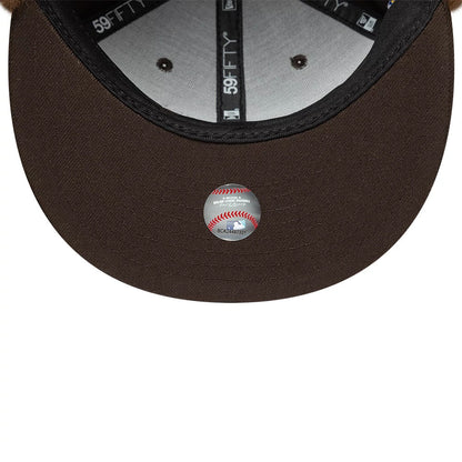 Pictured is this MLB World Series New York Yankees Dogear 59FIFTY Fitted cap in dark brown. 11
