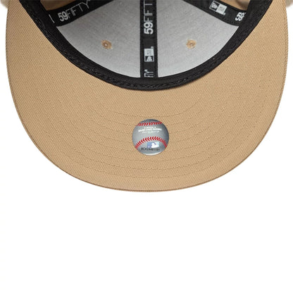Pictured is this MLB World Series LA Dodgers Dogear 59FIFTY Fitted cap in light beige. 11