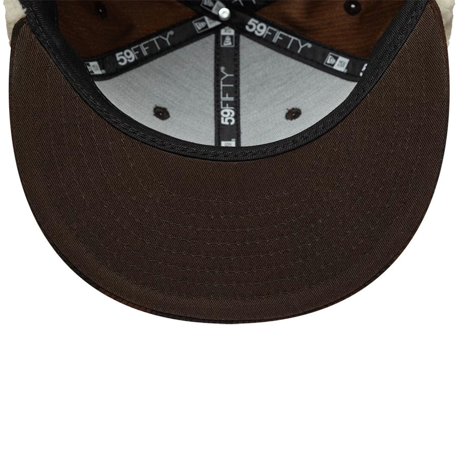 Pictured is this New Era Cord Downflap 59FIFTY Fitted cap in dark brown. 11
