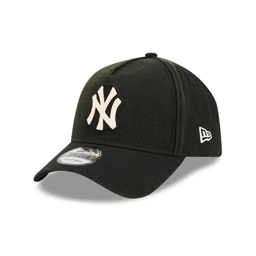 New York Yankees MLB Washed Canvas Black New Era 9FORTY A-Frame Adjustable Cap, three-quarter view showing the raised white NY logo on the front panel, black curved visor, black top button, and New Era flag logo on the left side.