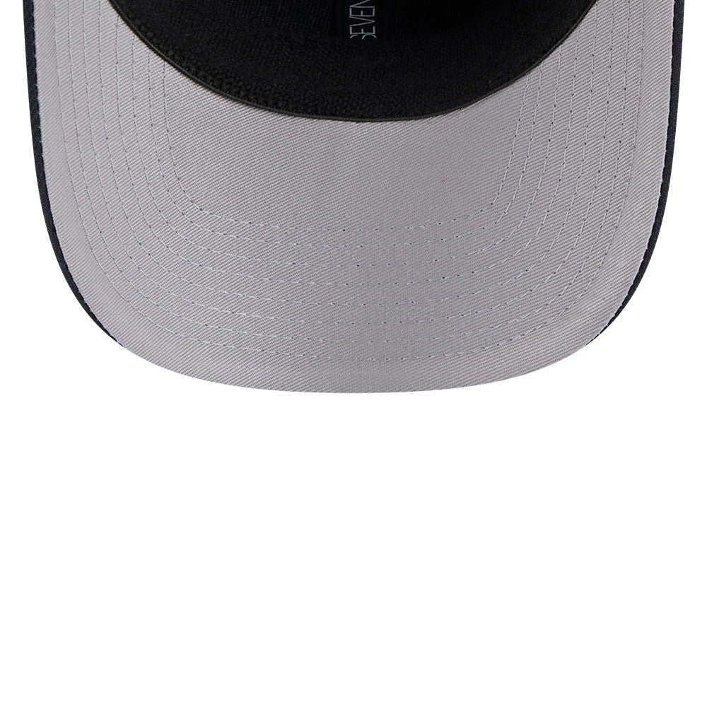 New York Yankees MLB Navy New Era 9SEVENTY Stretch Snap Adjustable Cap, inside view showing a grey undervisor with white stitching and a contrasting black inner sweatband, through the curved visor edge.