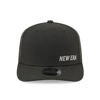 New Era Flawless Black New Era 9SEVENTY Stretch Snap Adjustable Cap, front view showing the white embroidered New Era logo on the right front panel, with a curved black visor and 9SEVENTY size sticker.