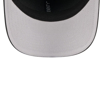 New Era Flawless Black 9SEVENTY Stretch Snap Adjustable Cap, inside view showing the light grey undervisor with detailed stitching, black sweatband and the New Era logo repeating along the black taping.