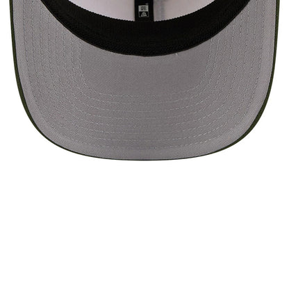 LA Dodgers MLB Rifle Green New Era 9SEVENTY Stretch Snap Adjustable Cap, inside view showing the grey undervisor, black sweatband, and branded taping running along the centre, all set against the rifle green outer visor edge.