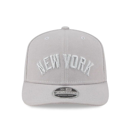 Pictured is this MLB Script New York Yankees 9SEVENTY Stretch Snap cap in grey. 2