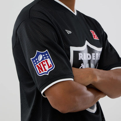 The model is wearing this NFL Mesh Las Vegas Raiders Oversized T-Shirt in black. 3