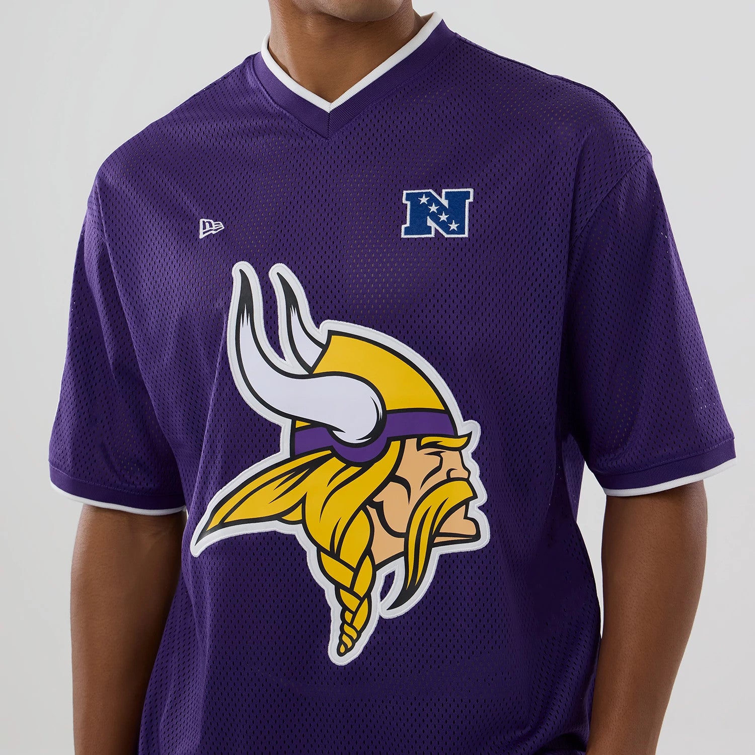 The model is wearing this NFL Mesh Minnesota Vikings Oversized T-Shirt in purple. 4
