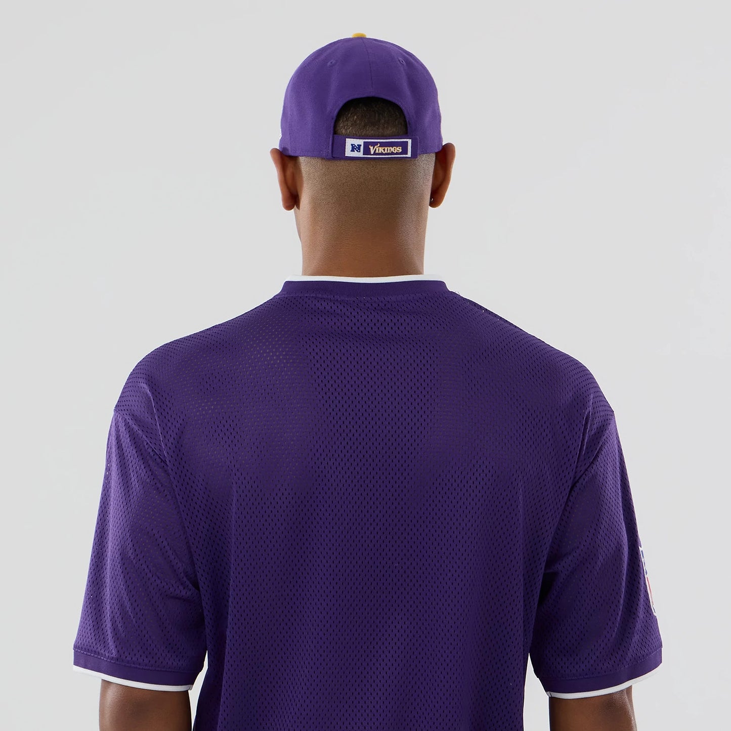 The model is wearing this NFL Mesh Minnesota Vikings Oversized T-Shirt in purple. 7