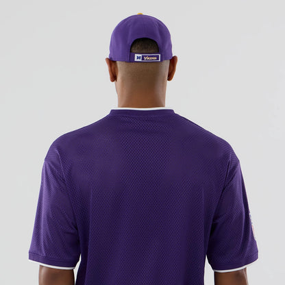 The model is wearing this NFL Mesh Minnesota Vikings Oversized T-Shirt in purple. 7