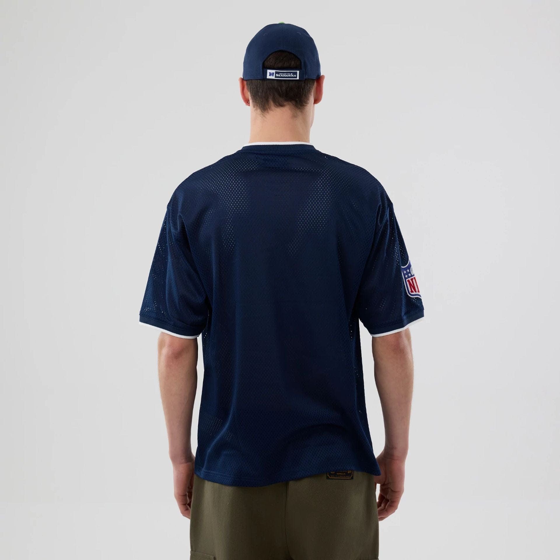 The model is wearing this NFL Mesh Seattle Seahawks Oversized T-Shirt in Navy. 2