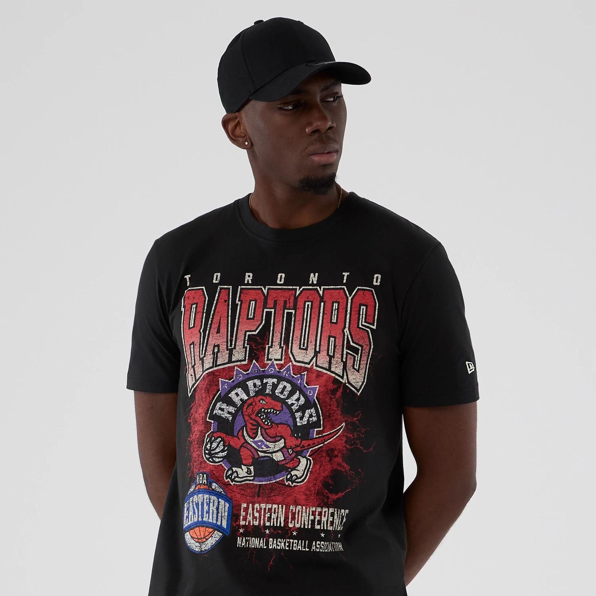 The model is wearing this NBA Hardwood Classic Toronto Raptors T-Shirt in black. 7