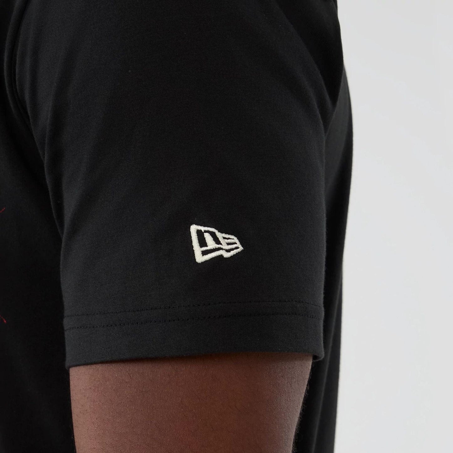 The model is wearing this NBA Hardwood Classic Toronto Raptors T-Shirt in black. 4