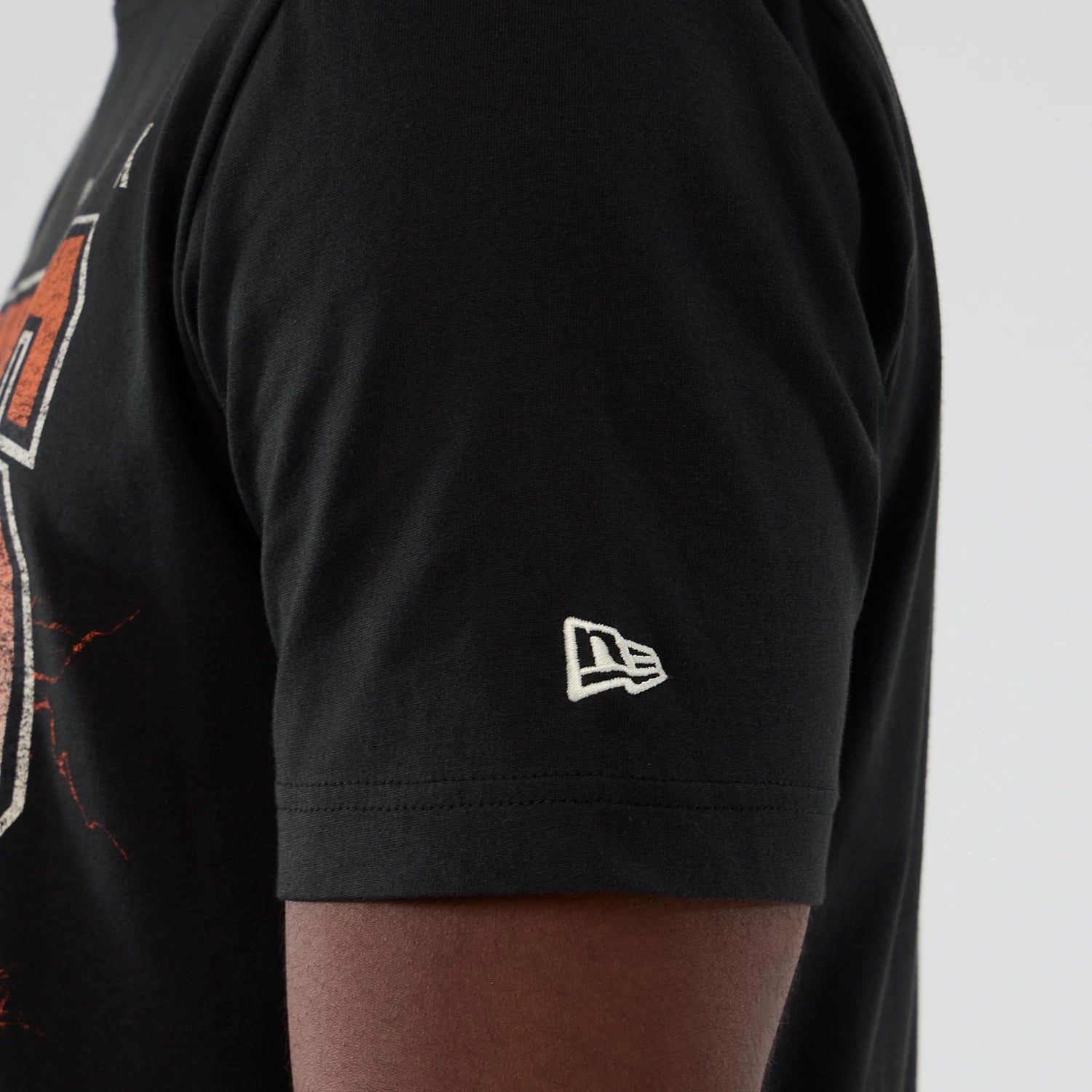 The model is wearing this NBA Hardwood Classic New York Knicks T-Shirt in black. 4