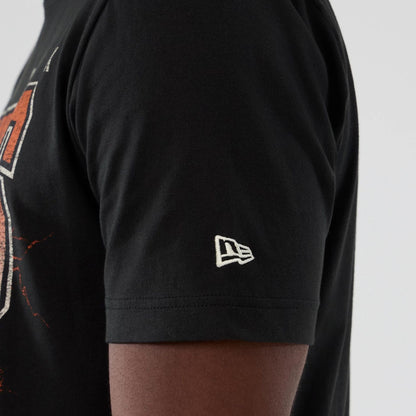 The model is wearing this NBA Hardwood Classic New York Knicks T-Shirt in black. 4