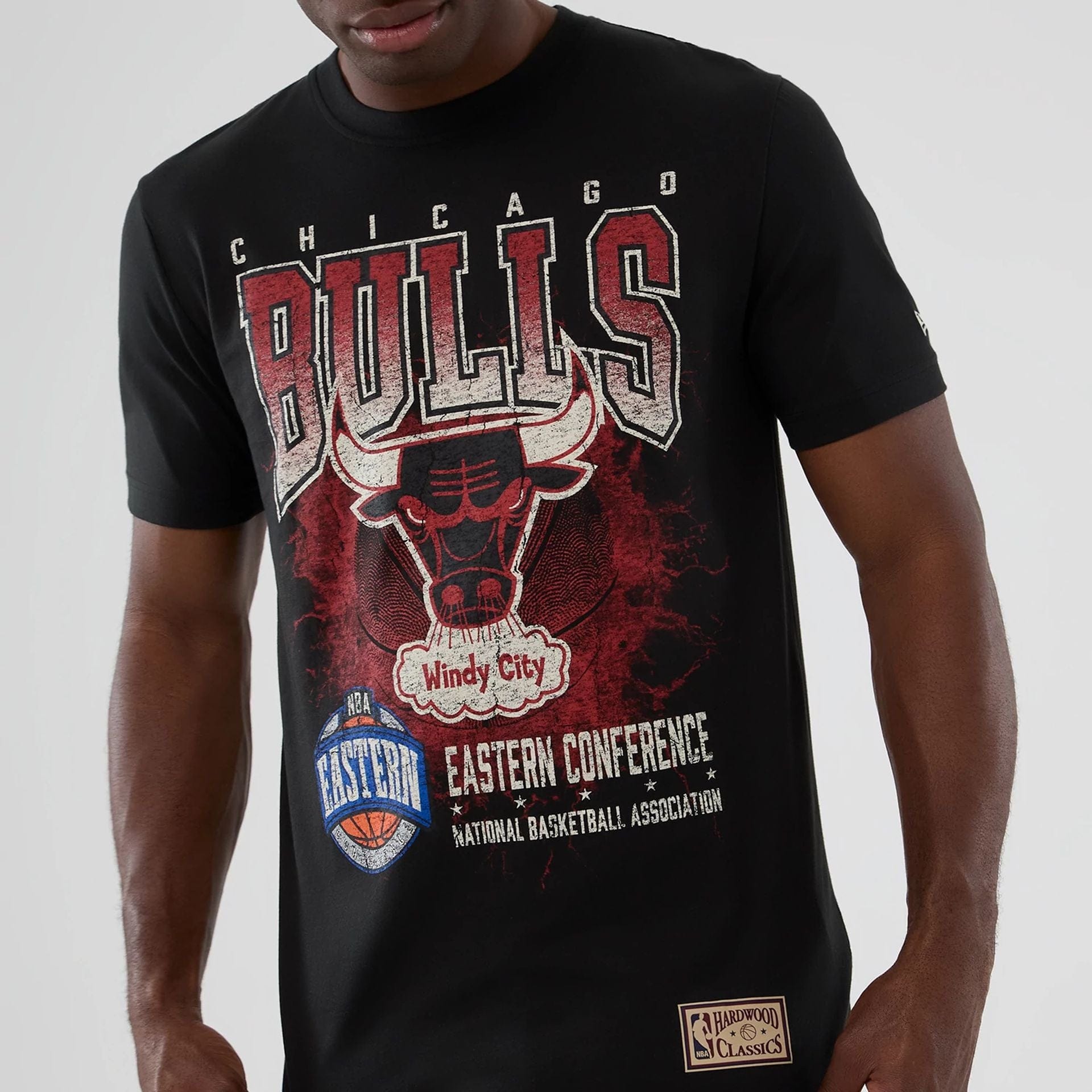 The model is wearing this NBA Hardwood Classic Chicago Bulls T-Shirt in black. 3