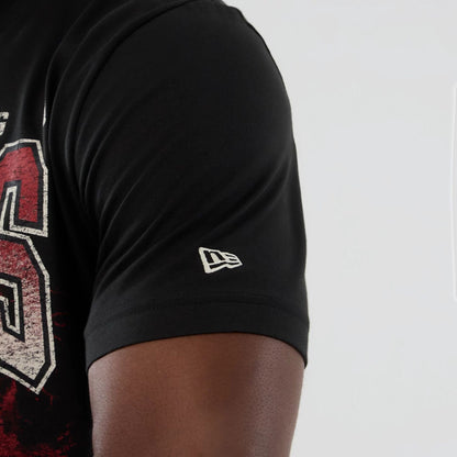 The model is wearing this NBA Hardwood Classic Chicago Bulls T-Shirt in black. 4