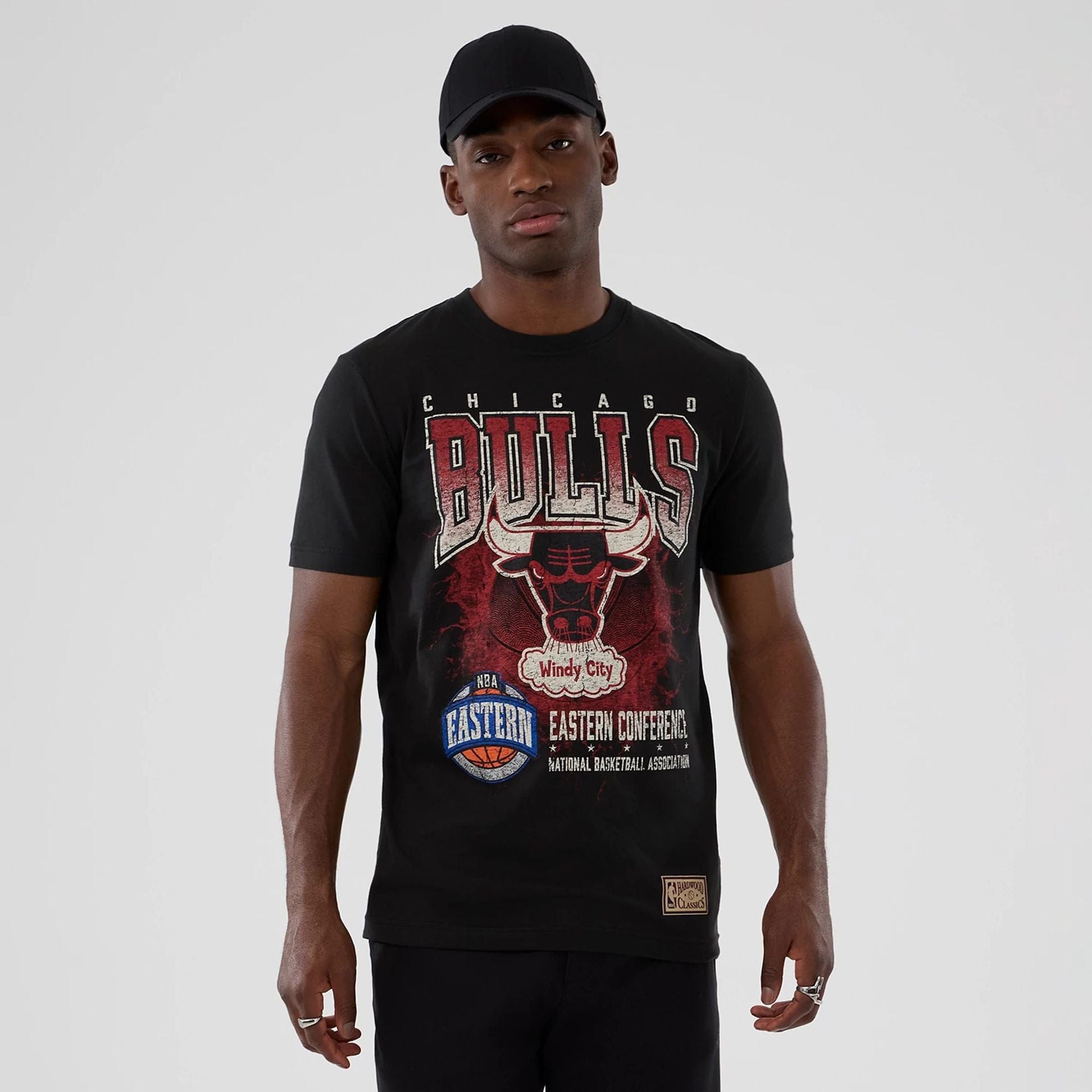 The model is wearing this NBA Hardwood Classic Chicago Bulls T-Shirt in black. 1