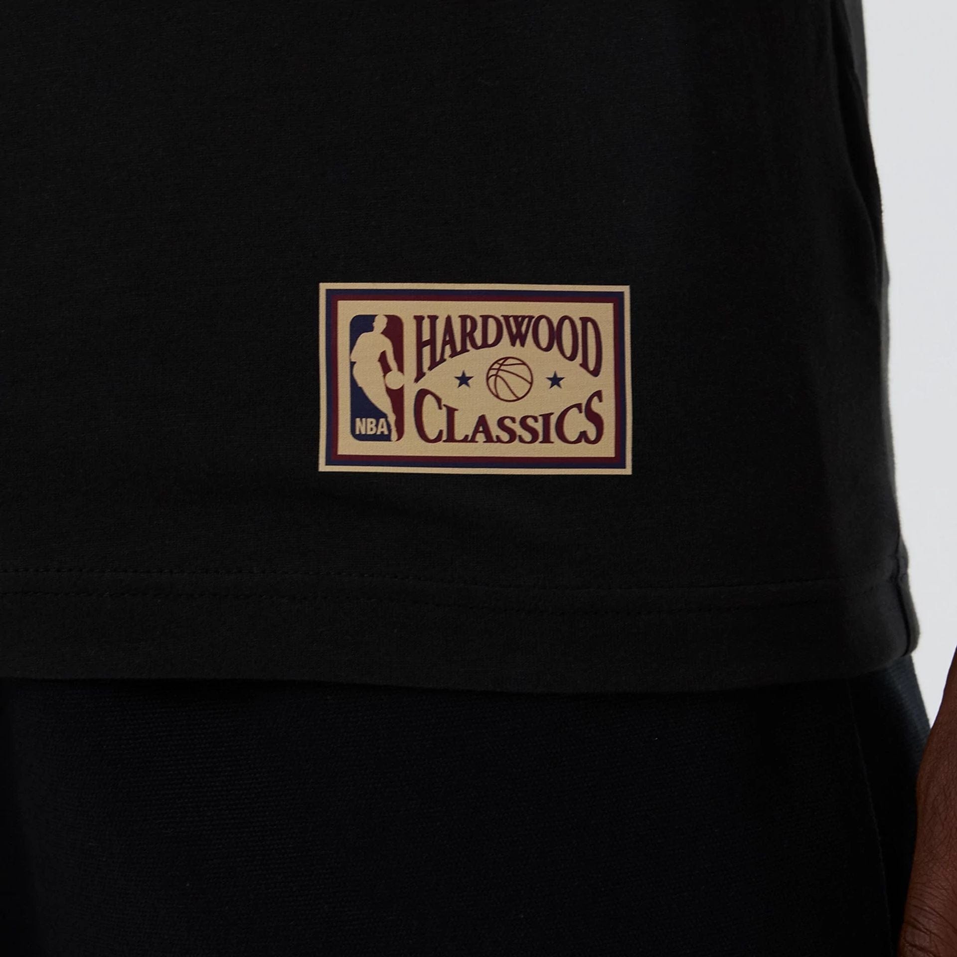 The model is wearing this NBA Hardwood Classic Boston Celtics T-Shirt in black. 5