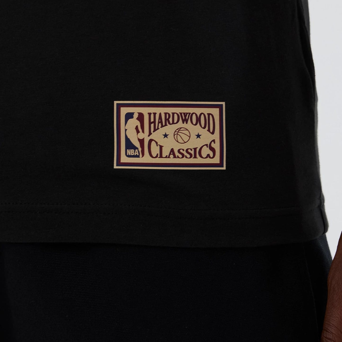 The model is wearing this NBA Hardwood Classic Boston Celtics T-Shirt in black. 5