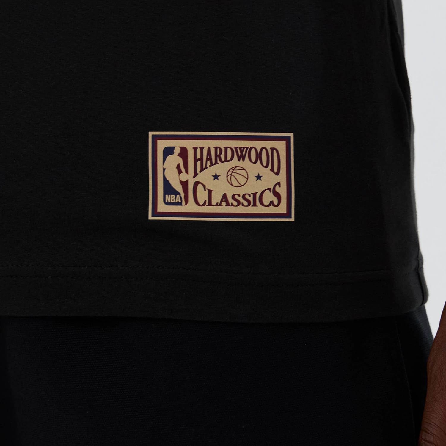 The model is wearing this NBA Hardwood Classic Boston Celtics T-Shirt in black. 5