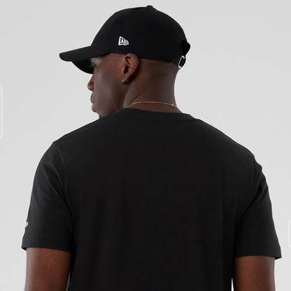 The model is wearing this NBA Hardwood Classic Boston Celtics T-Shirt in black. 6