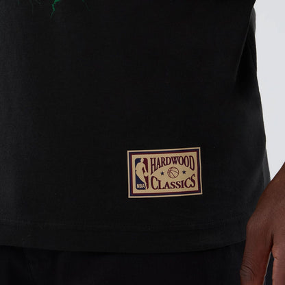 The model is wearing this NBA Hardwood Classic Minnesota Timberwolves T-Shirt in black. 5