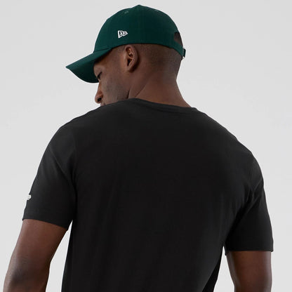 The model is wearing this NBA Hardwood Classic Minnesota Timberwolves T-Shirt in black. 6