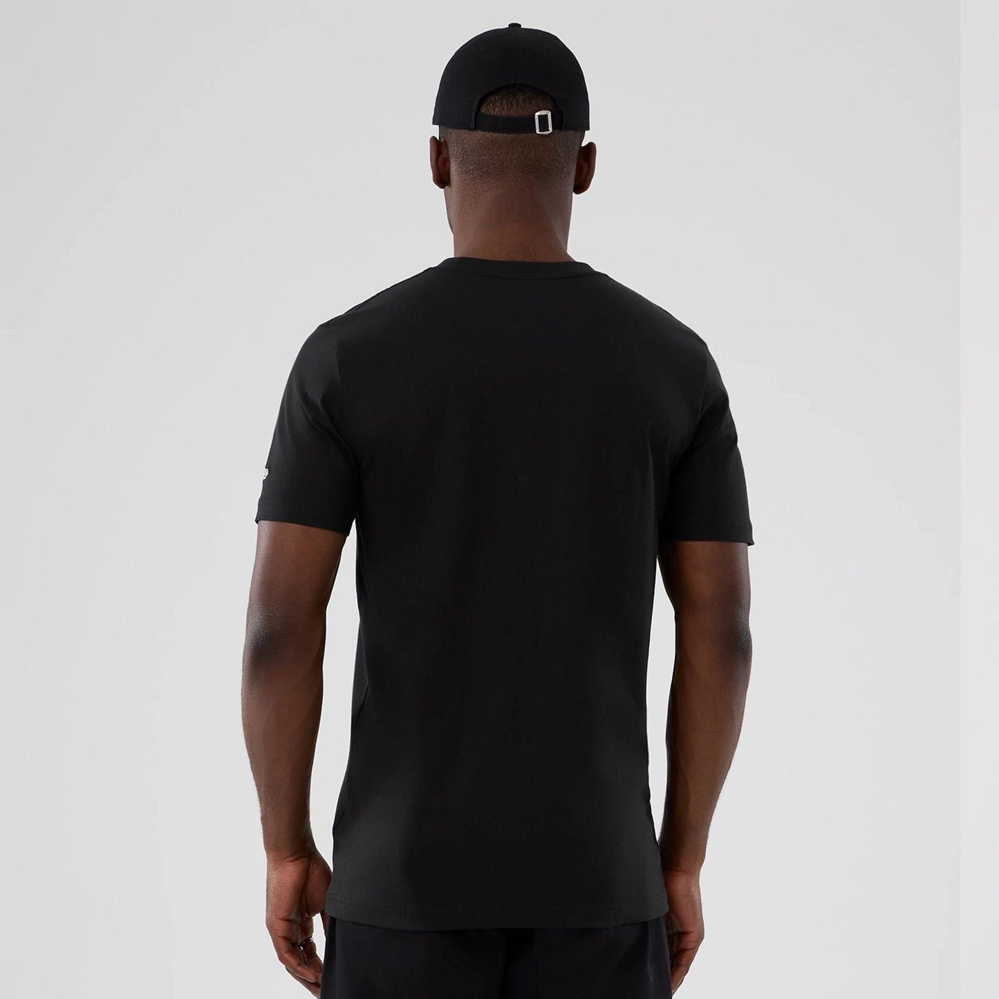 The model is wearing this NBA Hardwood Classic Houston Rockets T-Shirt in black. 2