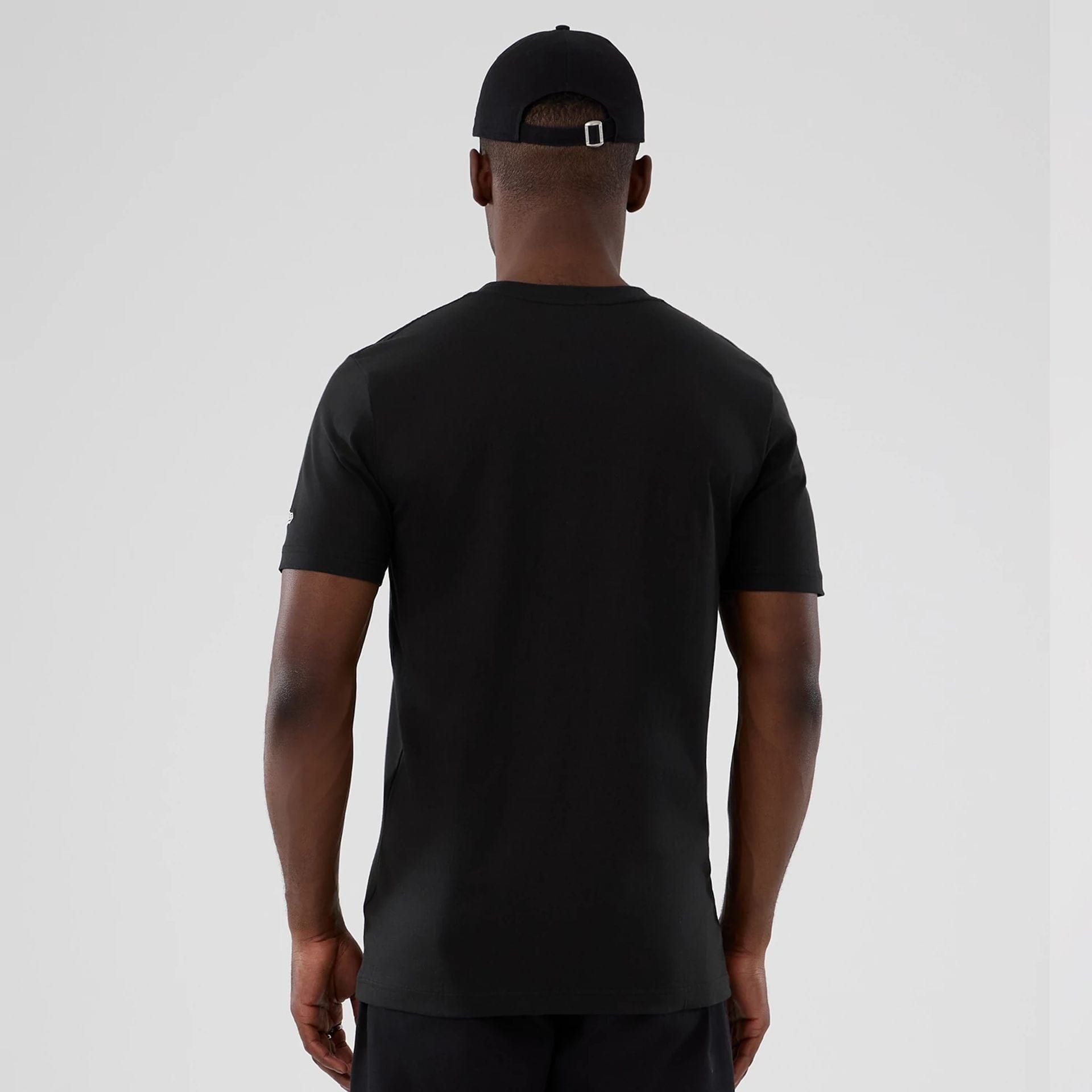 The model is wearing this NBA Hardwood Classic Houston Rockets T-Shirt in black. 2