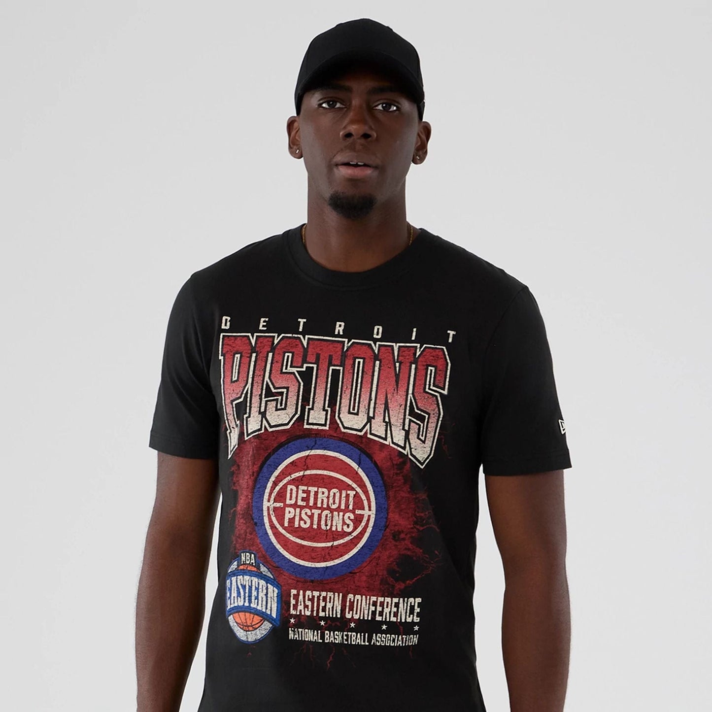 The model is wearing this NBA Hardwood Classic Detroit Pistons T-Shirt in black. 7