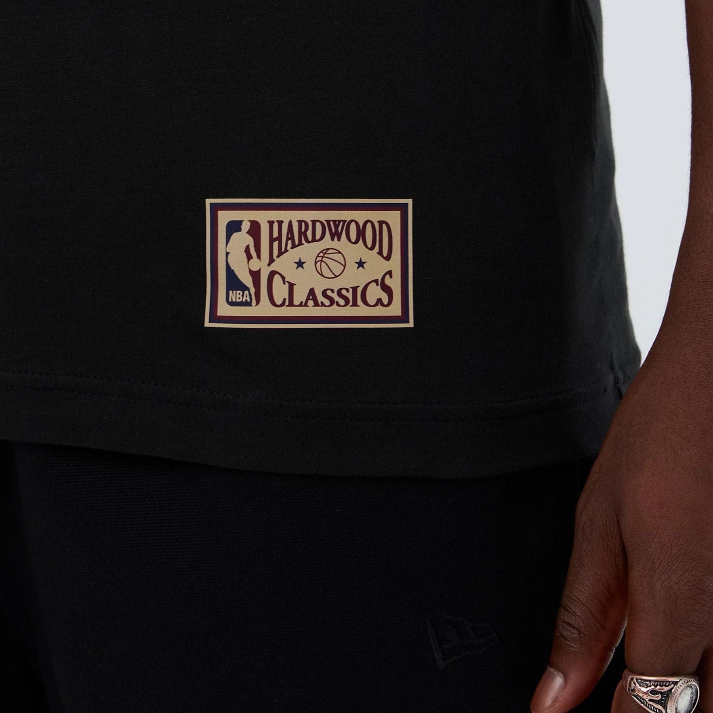 The model is wearing this NBA Hardwood Classic Detroit Pistons T-Shirt in black. 5