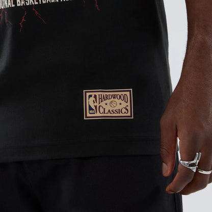 The model is wearing this NBA Hardwood Classic Denver Nuggets T-Shirt in black. 5