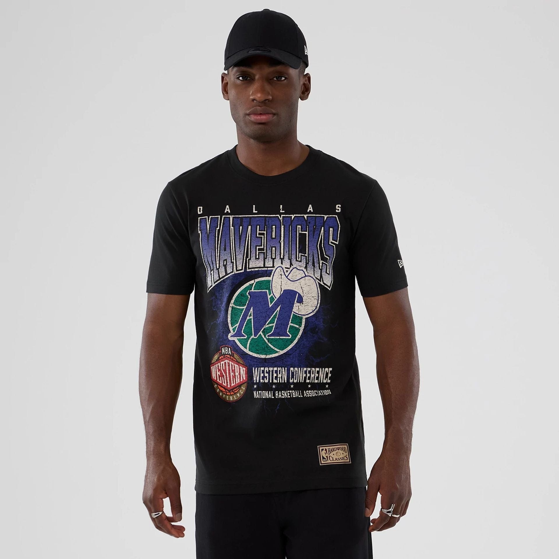 The model is wearing this NBA Hardwood Classic Dallas Mavericks T-Shirt in black. 1