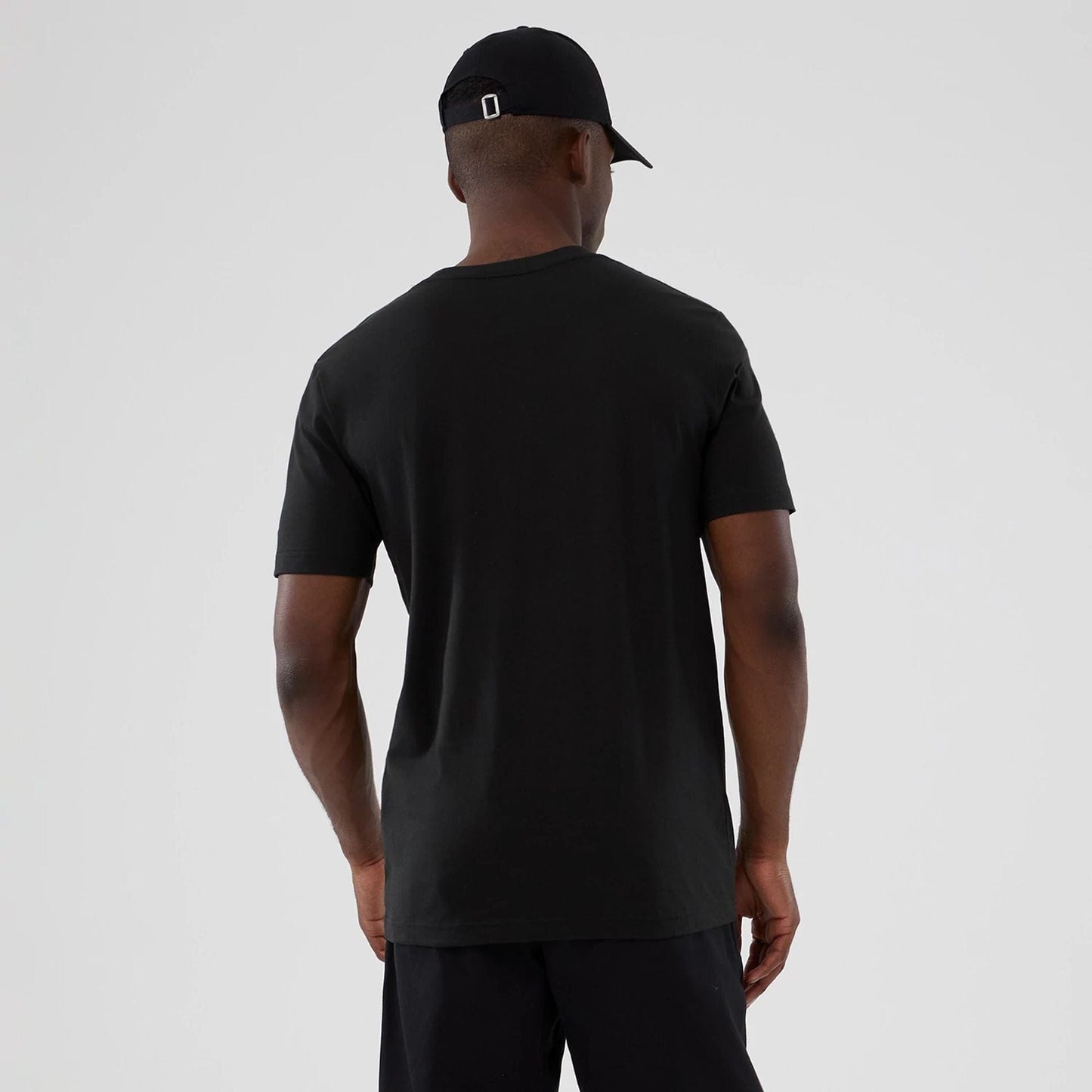 The model is wearing this NBA Hardwood Classic Charlotte Hornets T-Shirt in black. 2