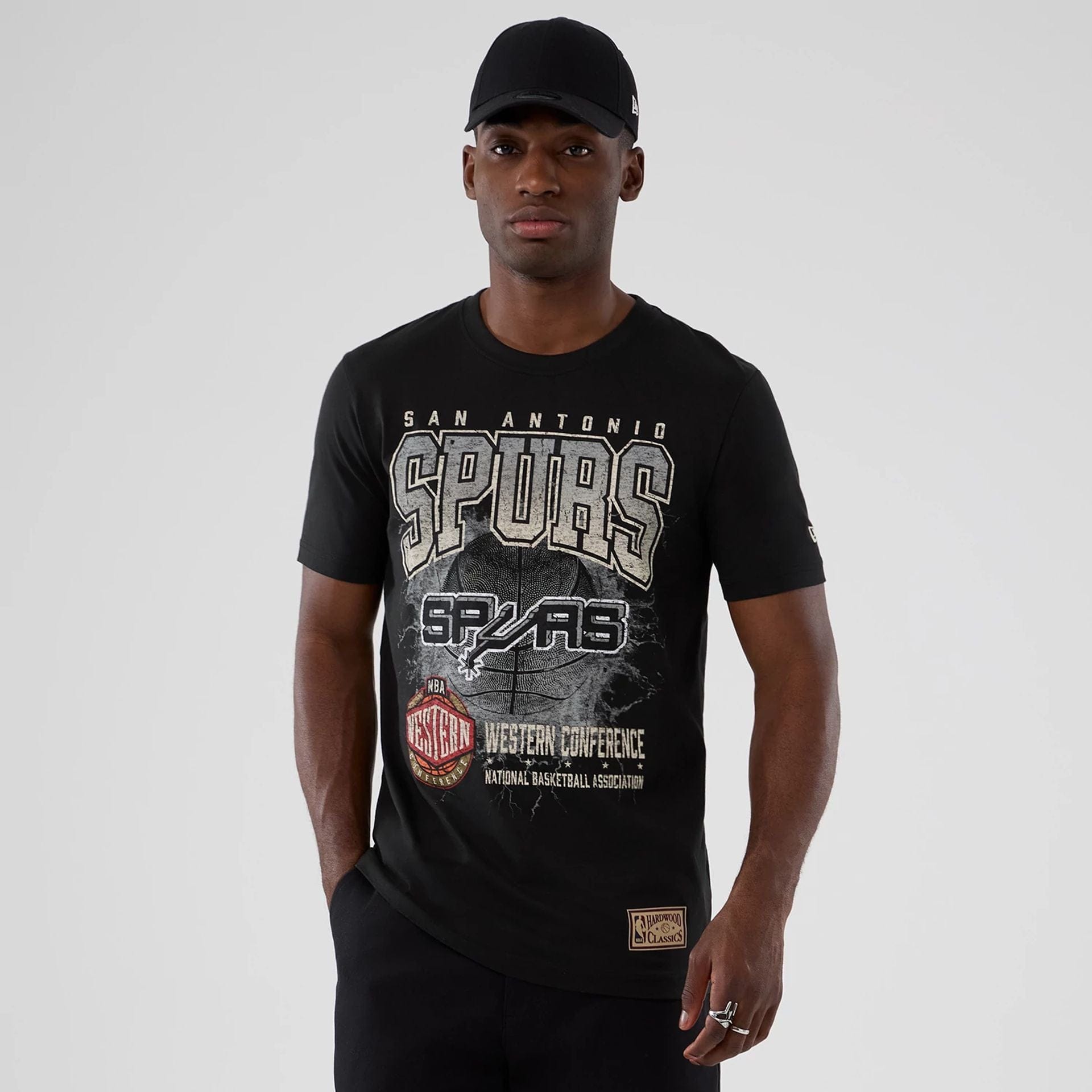 The model is wearing this NBA Hardwood Classic San Antonio Spurs T-Shirt in black. 7