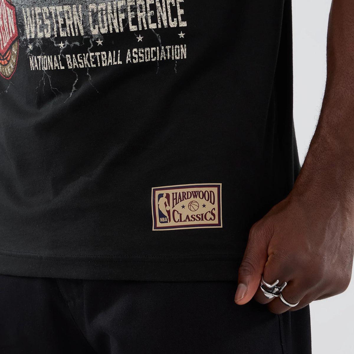The model is wearing this NBA Hardwood Classic San Antonio Spurs T-Shirt in black. 6