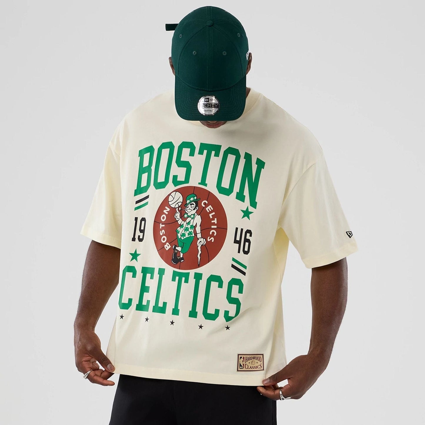 The model is wearing this NBA Hardwood Classic Boston Celtics T-Shirt in cream. 7